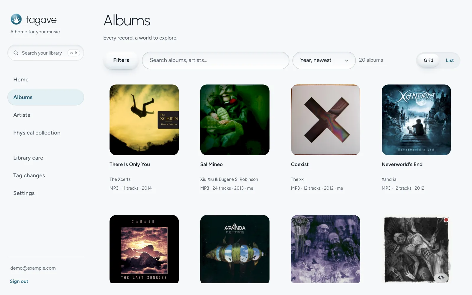 The album grid sorted by year, with cover art, artist, format, track count and year under each cover.